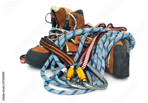 climbing and hiking gear - carabiners, ropes and boots