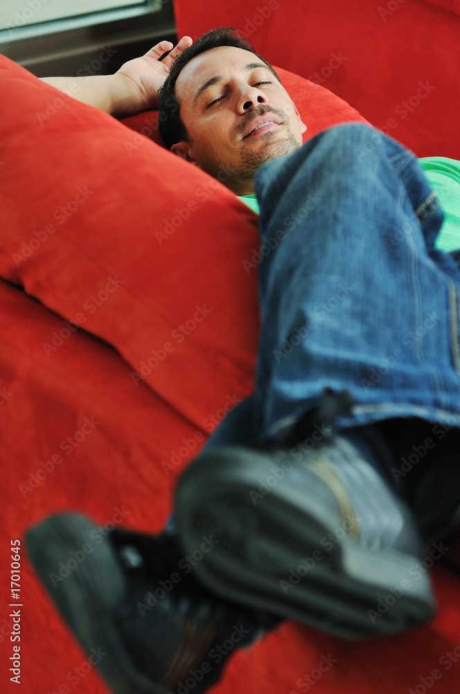 Obraz premium man relaxing on sofa