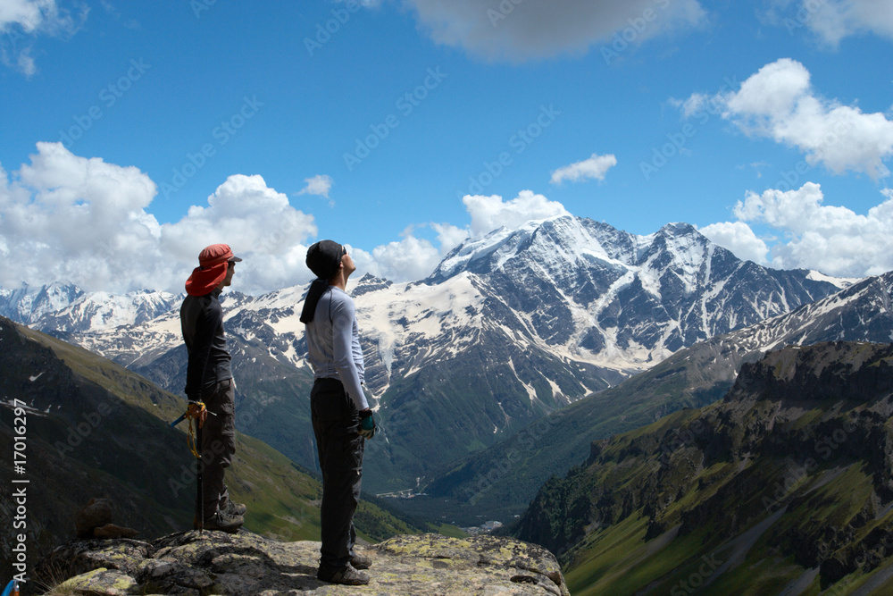 two climbers looking at the mountains
