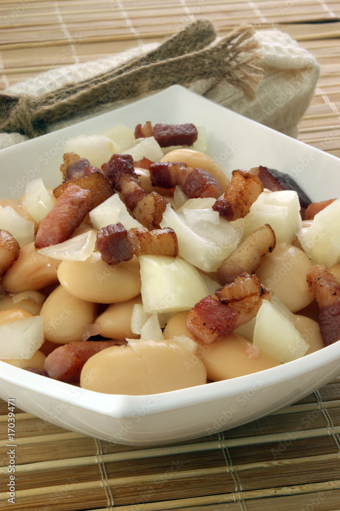white bean salad in bowl with onion and bacon white bean salad in bowl with onion and bacon