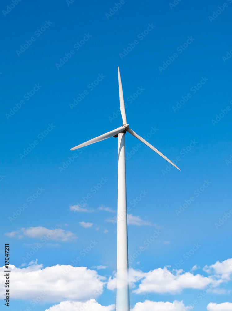 Wind power station - wind turbine against the blue sky Wind power station - wind turbine against the blue sky