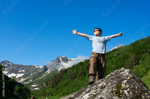 Happy boy in Caucasus mountains
