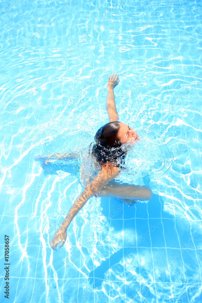 woman enjoying a swimming pool