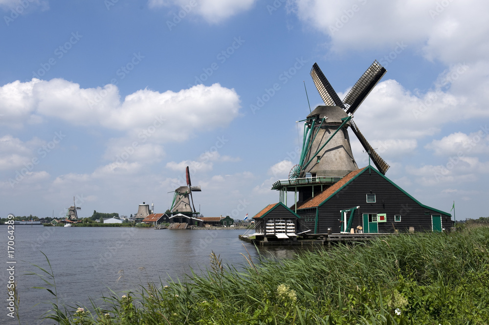 Dutch windmill on a canals edge