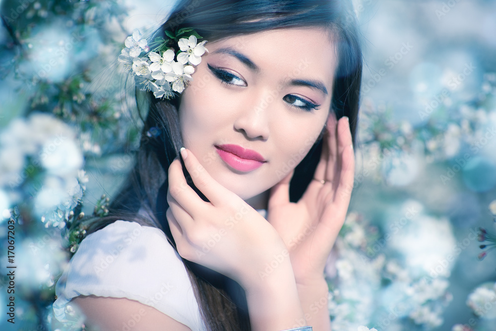 Young woman with cherry flowers Young woman with cherry flowers