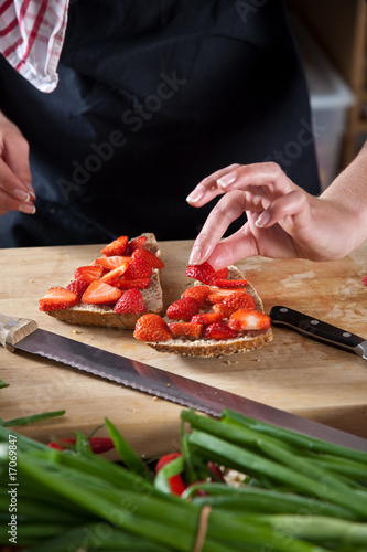 Making a strawberry sandwich