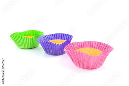 Home made cupcakes over white background