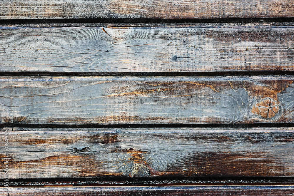 Dark painted weathered wooden fence texture Dark painted weathered wooden fence texture