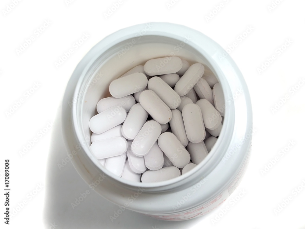 tablets in bottle isolated on white tablets in bottle isolated on white