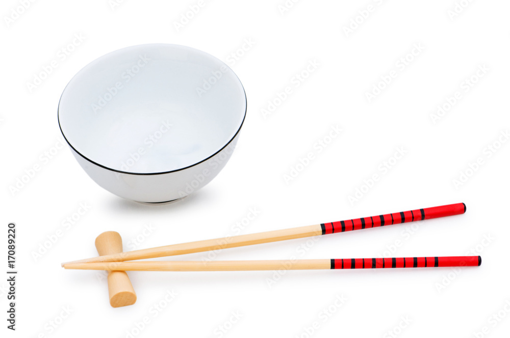 Bowl and chopsticks isolated on the white Bowl and chopsticks isolated on the white