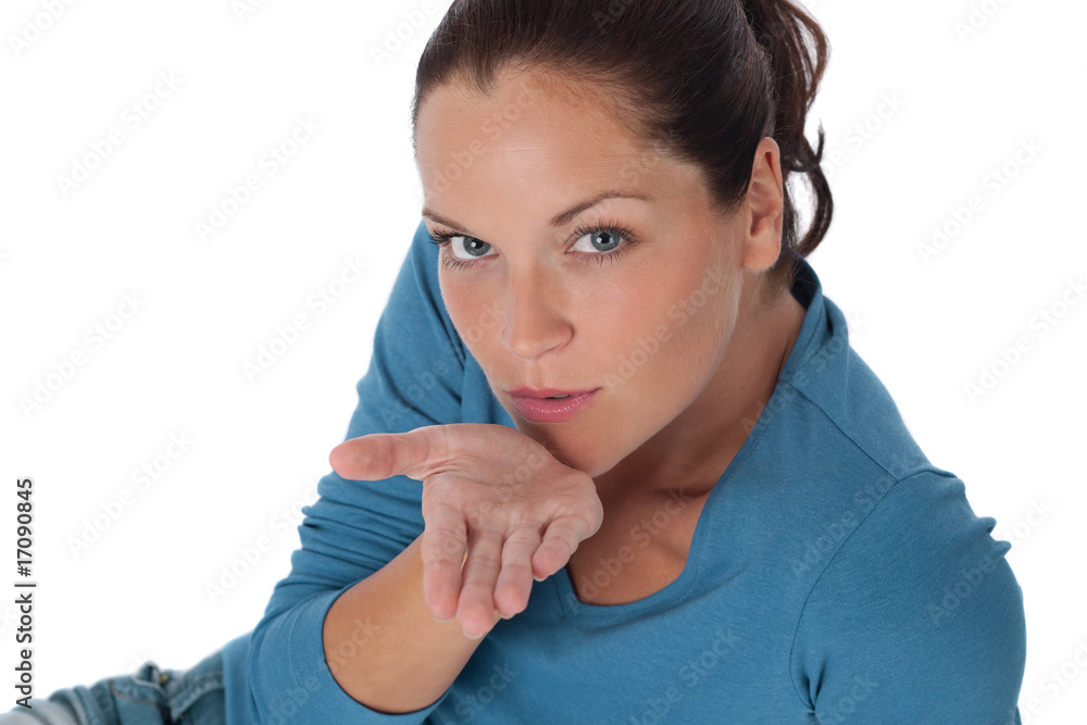 Brown hair woman blowing a kiss Brown hair woman blowing a kiss