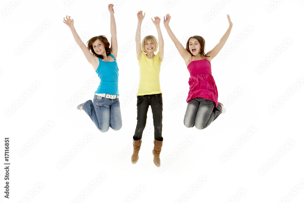 Group Of Three Young Girls Leaping In Air