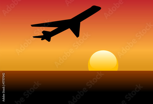 Airline jet silhouette takeoff into sunset or dawn