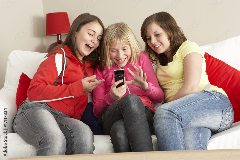 Group Of Three Girls Reading Text Message Group Of Three Girls Reading Text Message