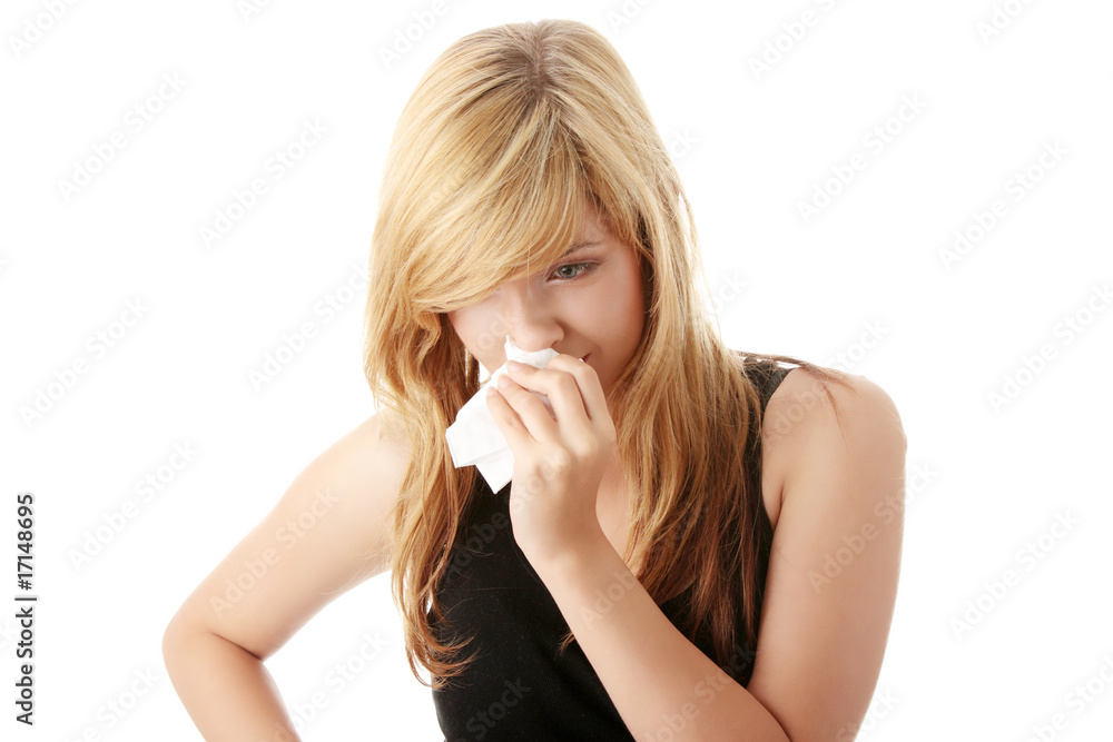 Young blonde woman having a cold Young blonde woman having a cold