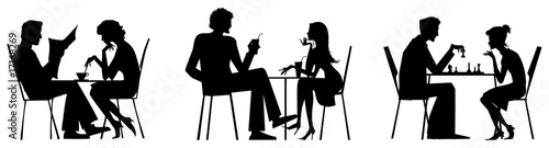 Couple silhouettes near table