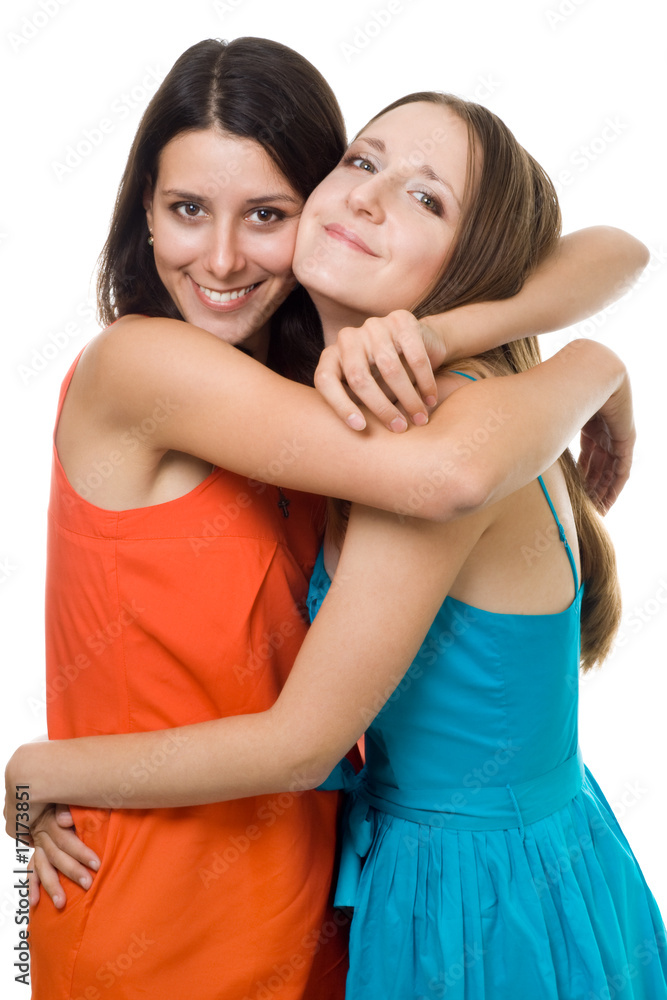 Two young woman embrace and smile Two young woman embrace and smile