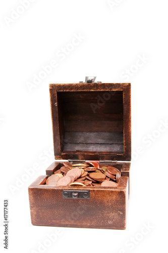 A wooden ancient chest full of money..