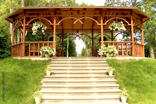 Fototapet Summer wooden arbour with a parade stairs