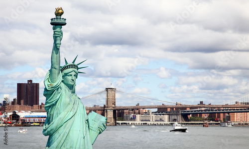 The Statue of Liberty and Brooklyn bridge © Gary
