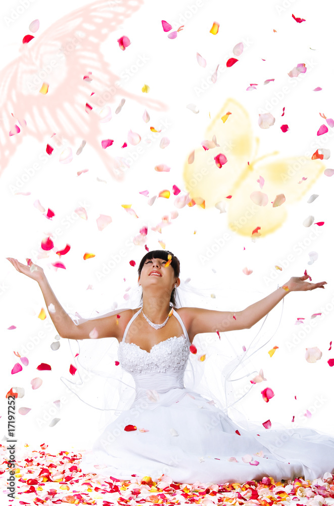 Cute bride throws rose petals and butterflys