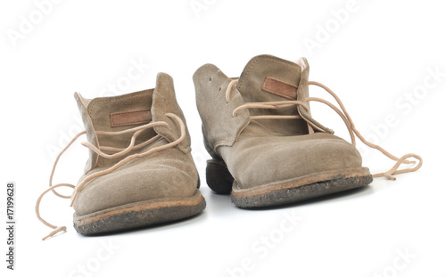 Old worn boots isolated on white background