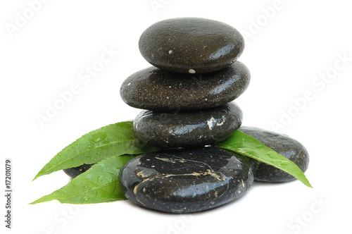 Spa stones and green leaves