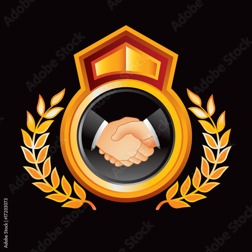 Business handshake on orange royal crest