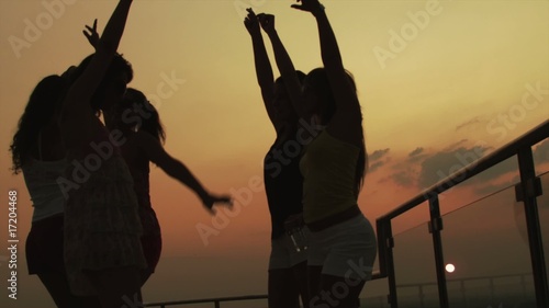 Girls dancing. Sunset, slowmotion RED ONE shot