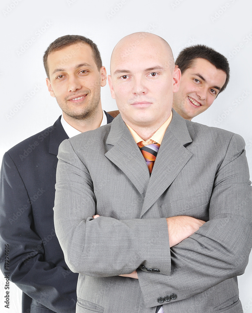 Group of young businessmen together on light background Group of young businessmen together on light background
