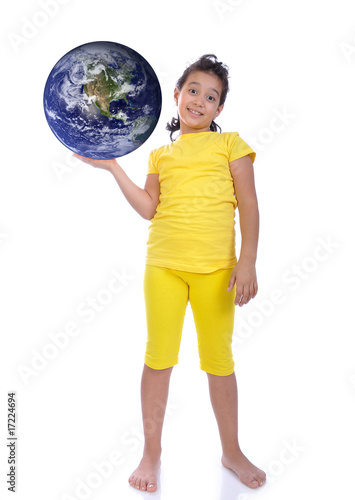 Little beautiful girl in yellow with Earth ih hand