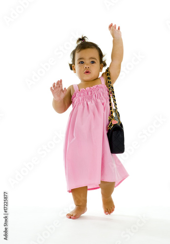 little thai-english girl walking with purse