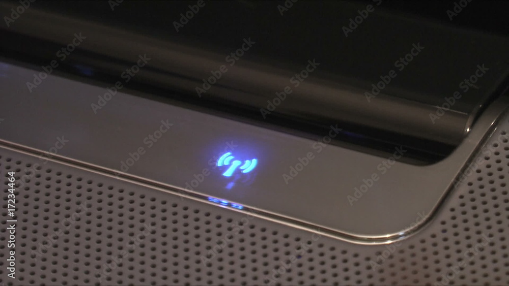 HD 1080i - Woman presses the wi-fi button HD 1080i - Woman presses the wi-fi button