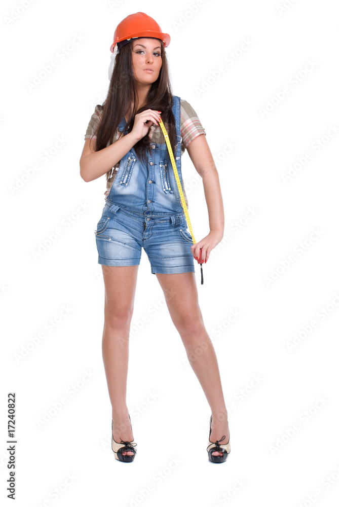 Young woman in orange helmet holding tape measure Young woman in orange helmet holding tape measure