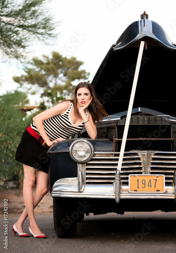 Girl in stripes with vintage car