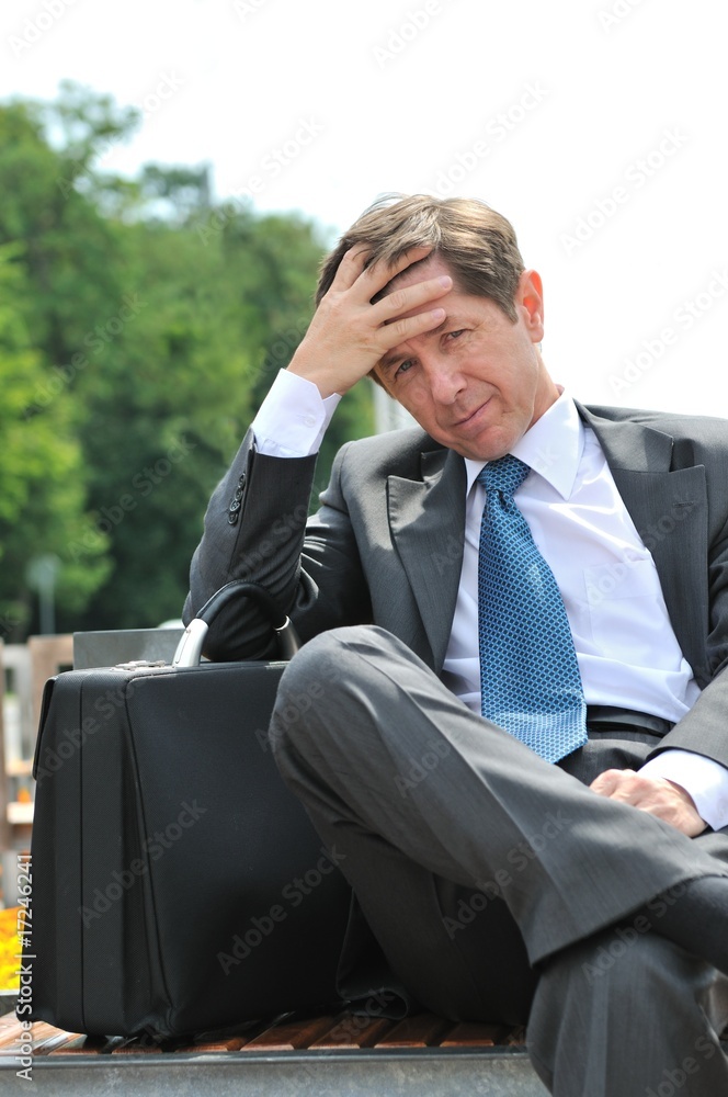 Depressed senior business man portrait