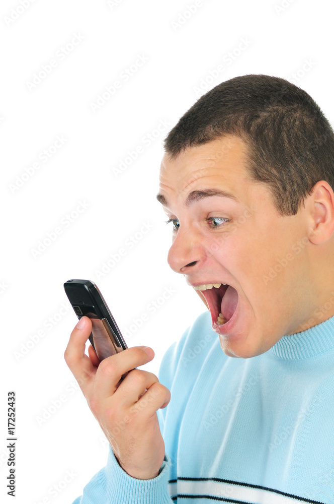 Angry man shouting at the phone isolated on white Angry man shouting at the phone isolated on white