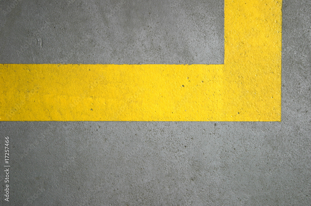 yellow lines on concrete floor