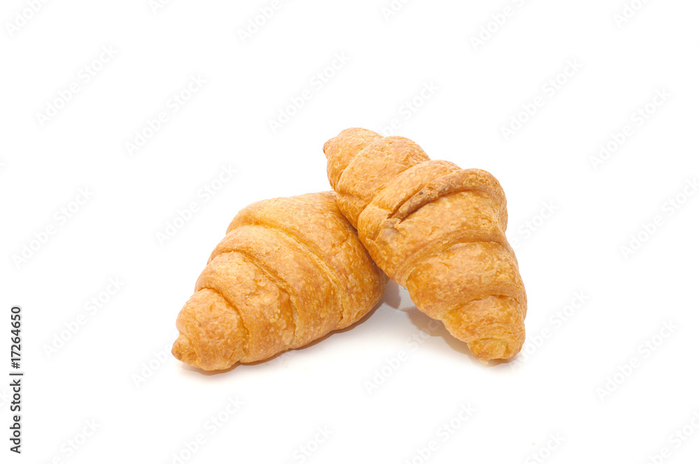 Two fresh croissant isolated over white background Two fresh croissant isolated over white background