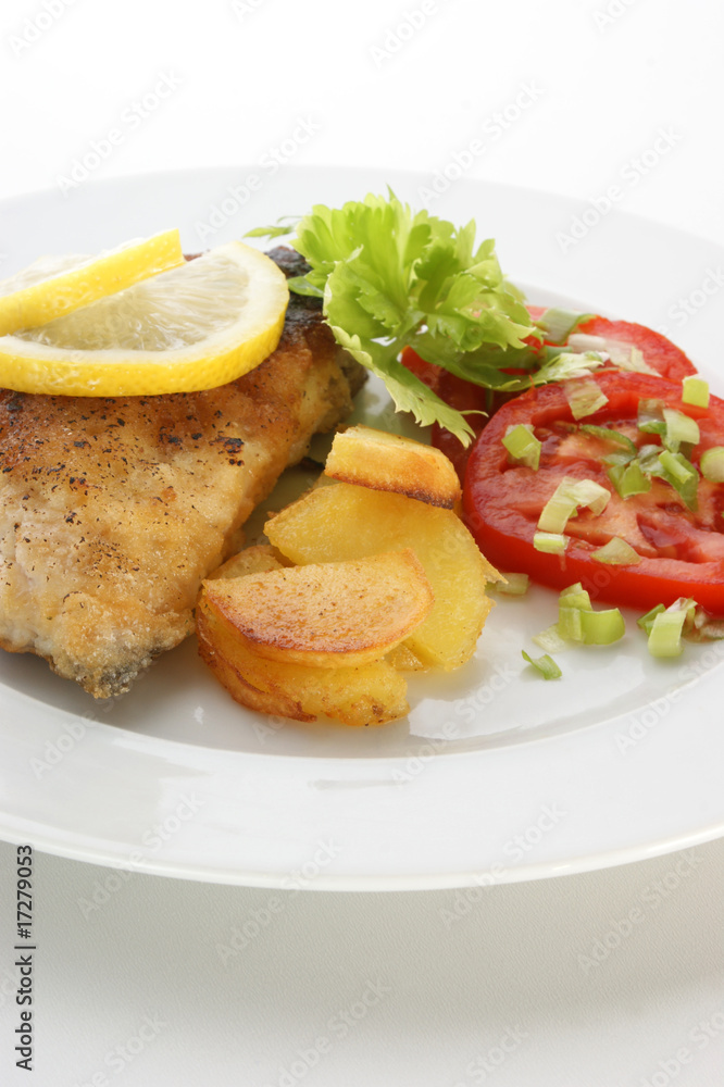 grilled carp fillet with organic vegetable on a plate