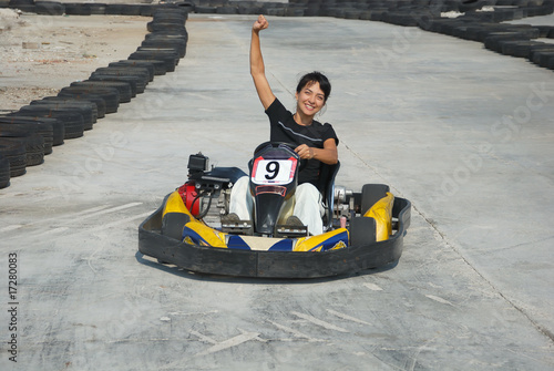 young female the winner of the karting race