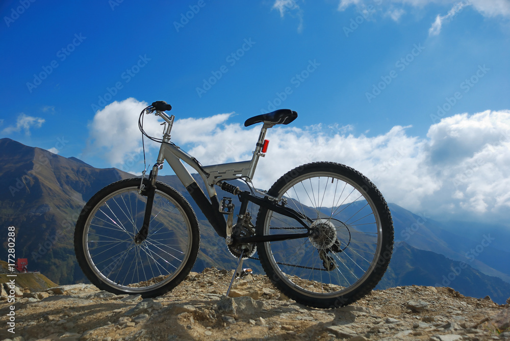 single mountain bike on a mountain rocky peak single mountain bike on a mountain rocky peak