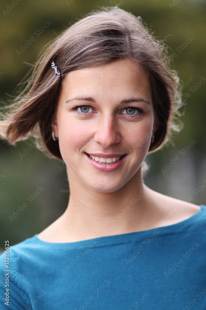 Closeup portrait of a happy young woman smiling Closeup portrait of a happy young woman smiling