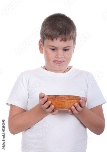 Boy is appetizing looks at a plate
