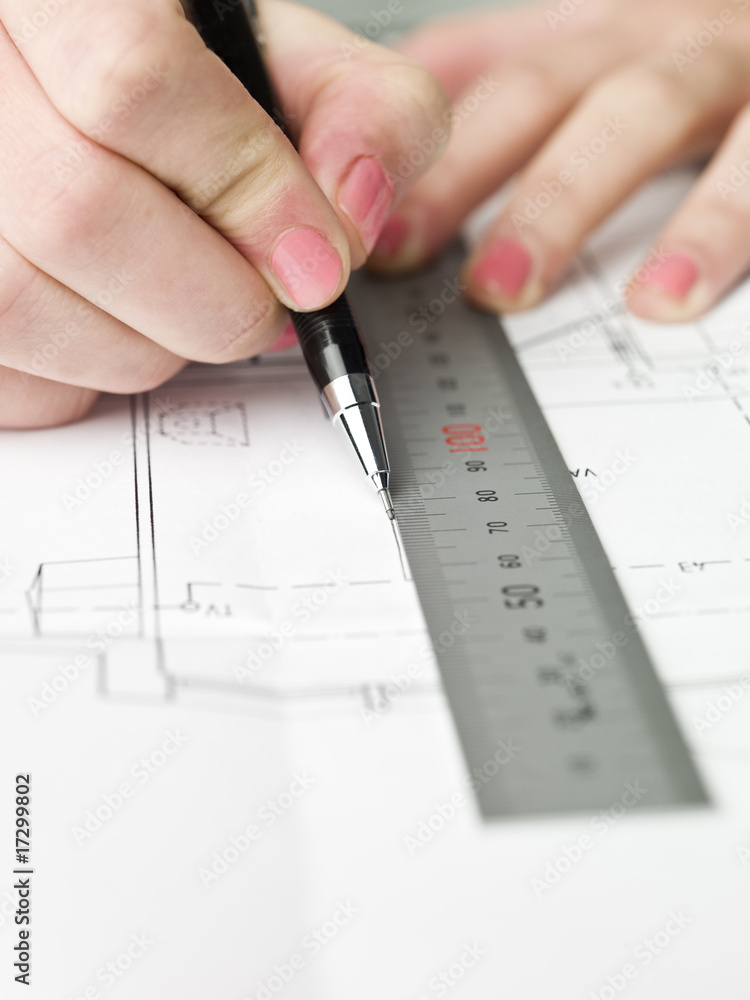 Architect working on a bluprint Architect working on a bluprint
