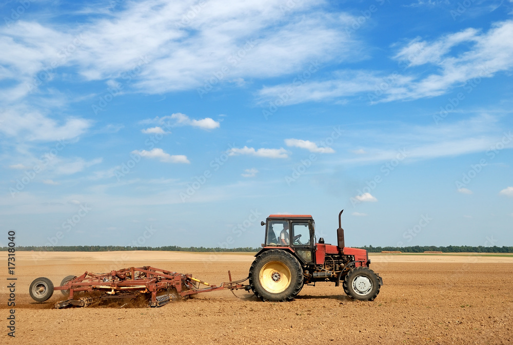 Fototapeta premium Agriculture ploughing tractor outdoors