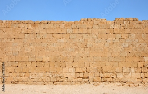 Ancient yellow stone wall texture