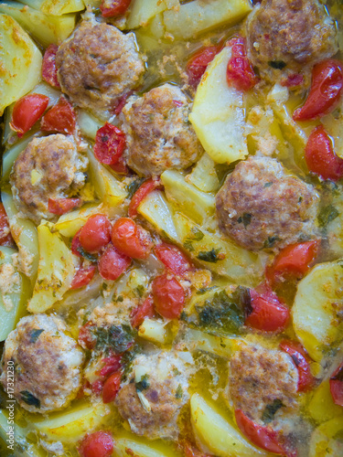 Meatballs with tomatoes and potatoes photo