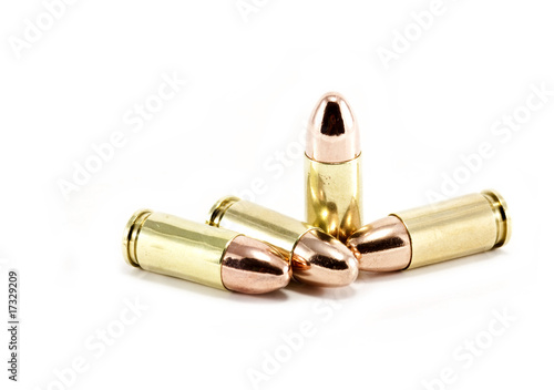 Four 9mm bullets on white