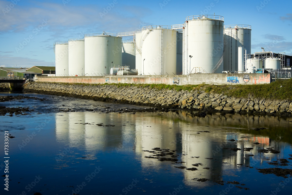 fuel tanks on the bank of the river fuel tanks on the bank of the river